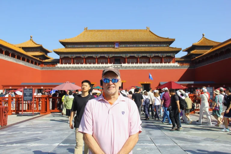 Michael poses at the Forbidden City entrance.